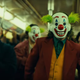 Joaquin Phoenix in a clown mask in Todd Philips’ Joker.